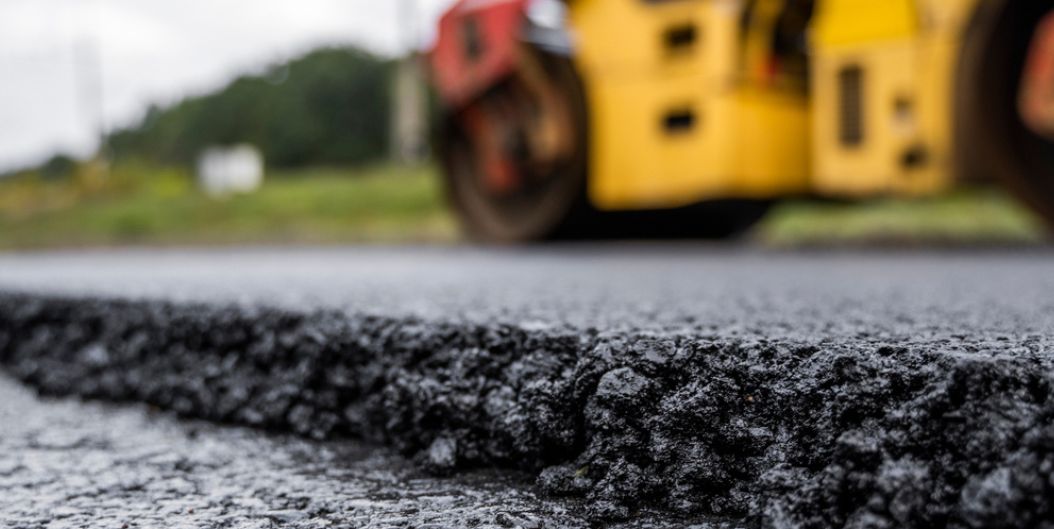 Fresh bitumen asphalt being laid